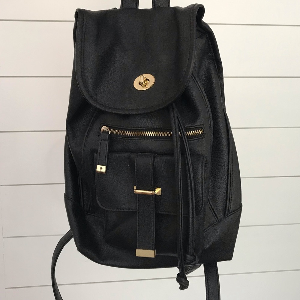 Faux leather backpack purse with gold accents